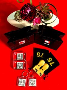Custom kanji hanko stamp with gift box and red keychains at Shodocafe7557 in Roppongi, Tokyo.