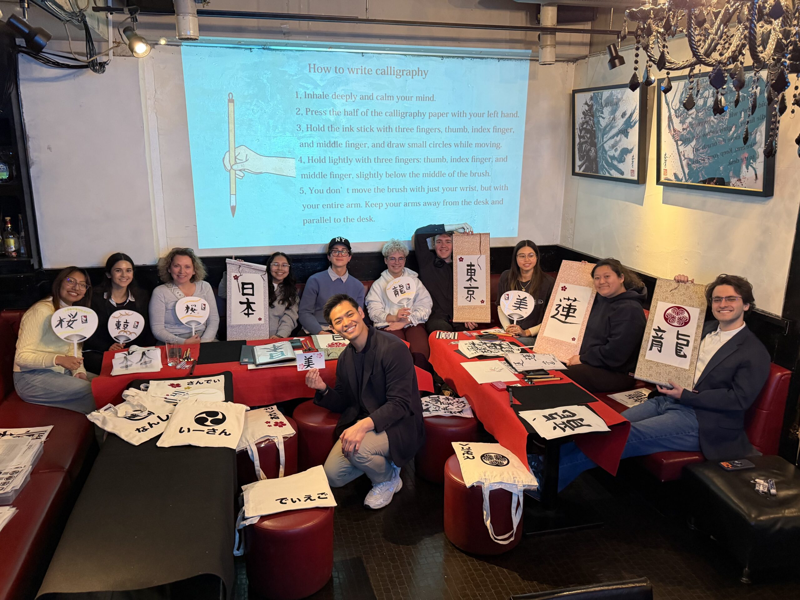 group calligraphy experience kanji art tokyo shodocafe7557 scaled school trip calligraphy Tokyo experience group of students