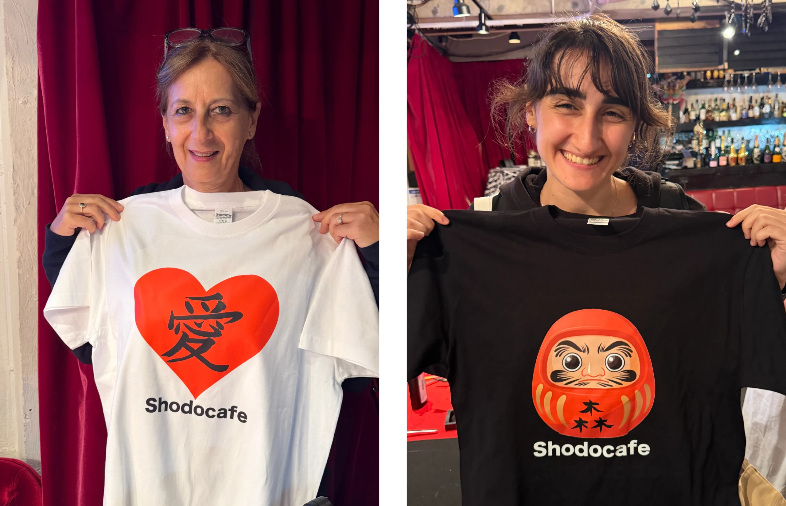 custom kanji tshirts love forest daruma tokyo scaled Guests holding custom Japanese T-shirts featuring the Kanji “愛” (Love) and “森” (Forest) with a Daruma design at Shodocafe7557 in Tokyo.