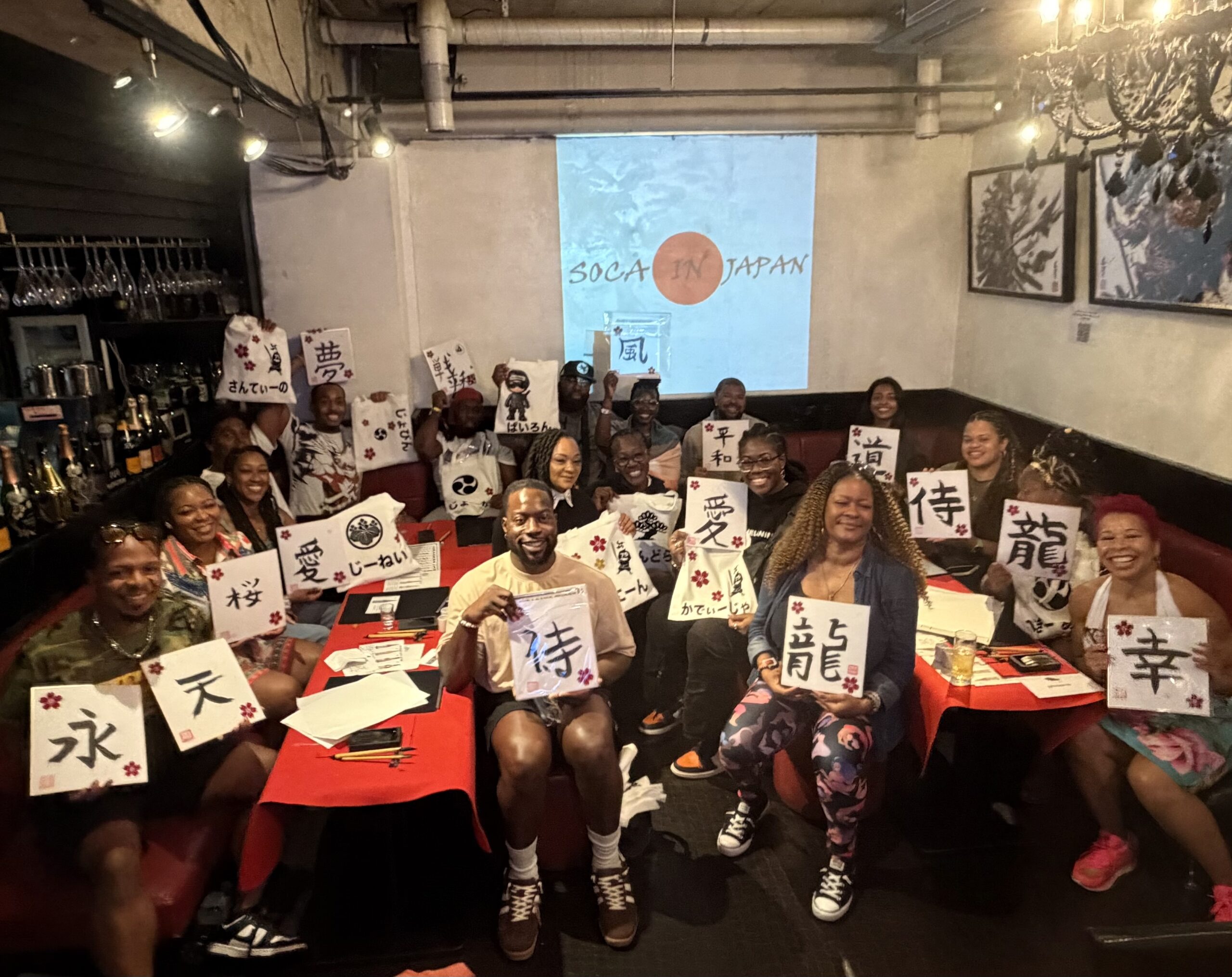 private group calligraphy hiragana tote bags tokyo scaled Japanese Calligraphy Experience Tokyo – private group guests at Shodocafe7557